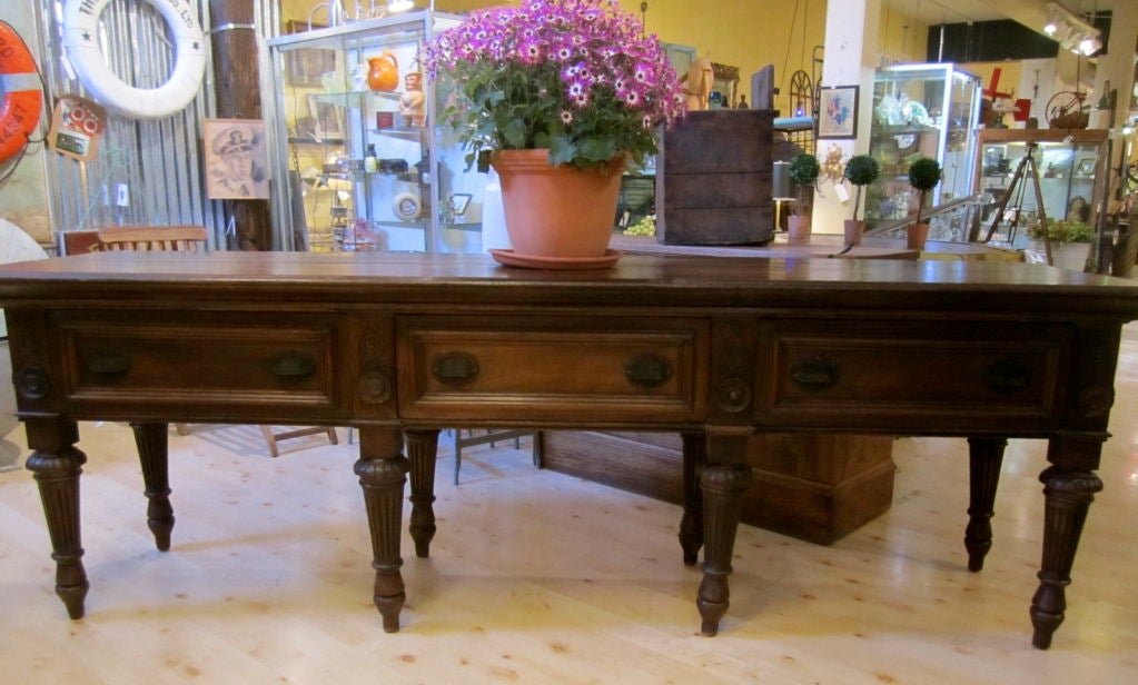 Exquisite Victorian display table with pass through drawers.