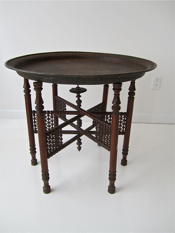 Brilliantly detailed Egyptian hammered copper tray table.