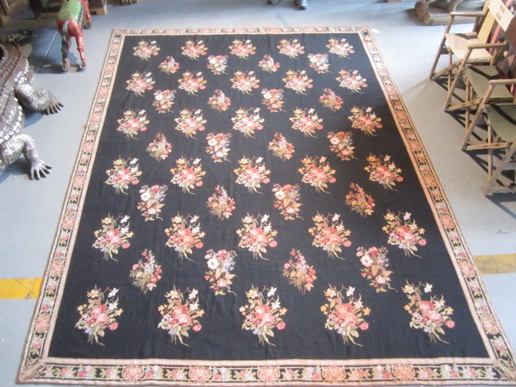 An exceptional needlepoint rug with gorgeous rose bouquets against a black field.

*We ship internationally* 
