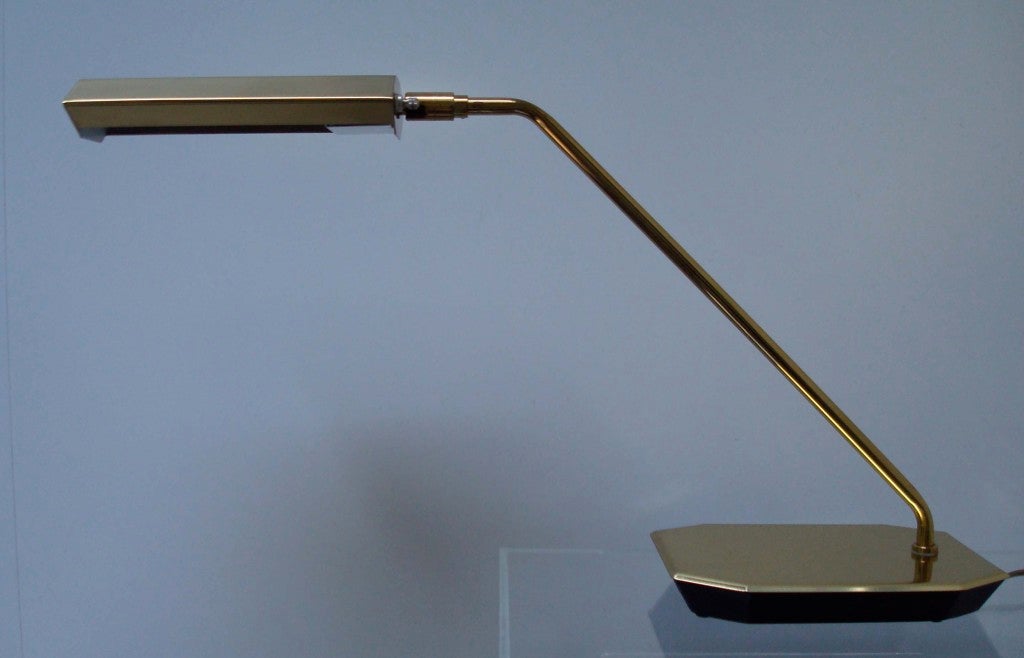 A wonderful Koch and Lowy desk lamp on black painted cast iron cantilevered base. This lamp has exceptional reach at 26.5