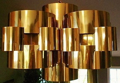 Interlocking brass pendant by C. Jere.