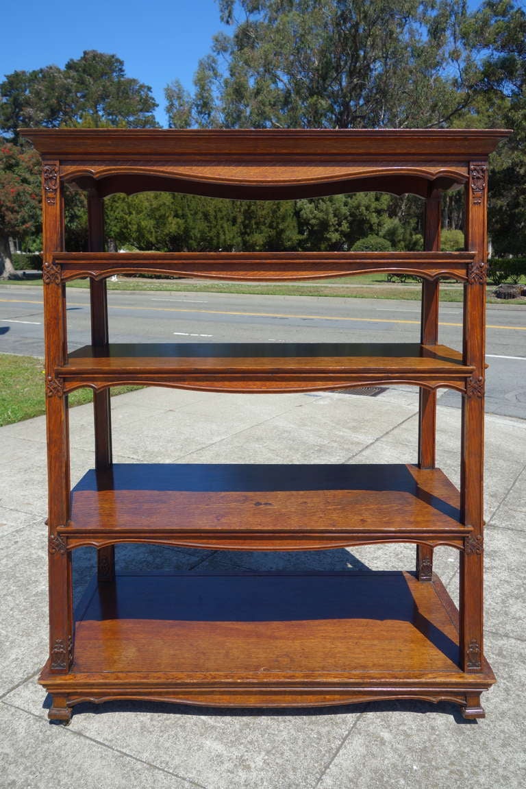 A well-functioning double-sided English oak bookcase from the Ariadne Getty collection.