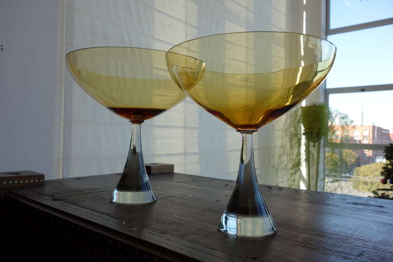An incredibly elegant pair of Swedish amber glass chalices.

Dimensions: 7 7/8