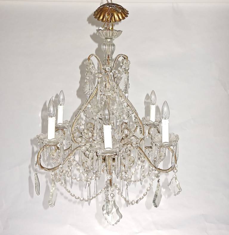 This is an extremely pretty French crystal chandelier that evokes of all the grandeur of long ago France.