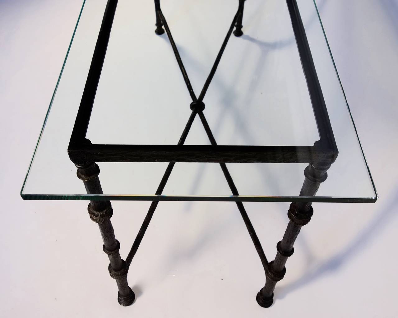 A captivating cast bronze console with thick glass top.

Dimensions with the glass as shown as follows:

32 1/2