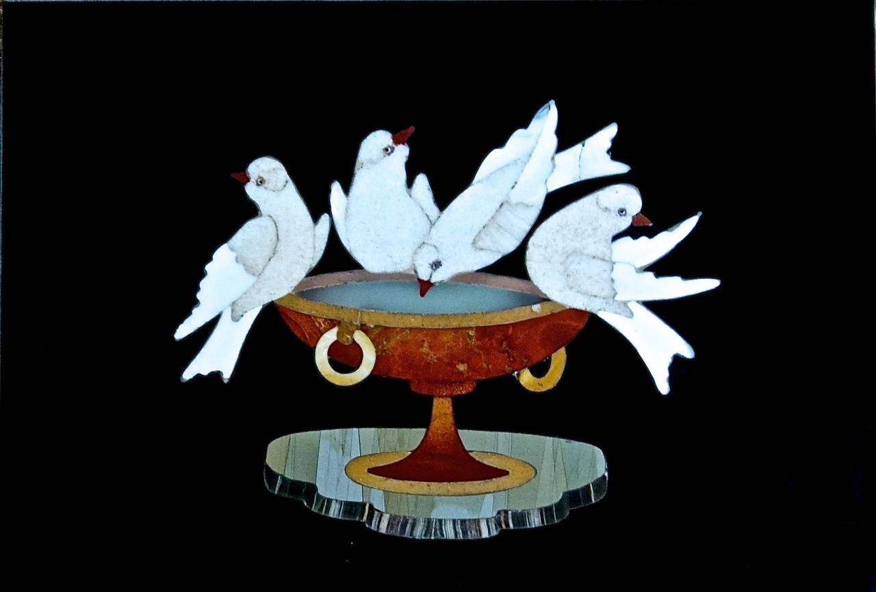 A gorgeous expression of doves at a fountain in Pietra Dura.