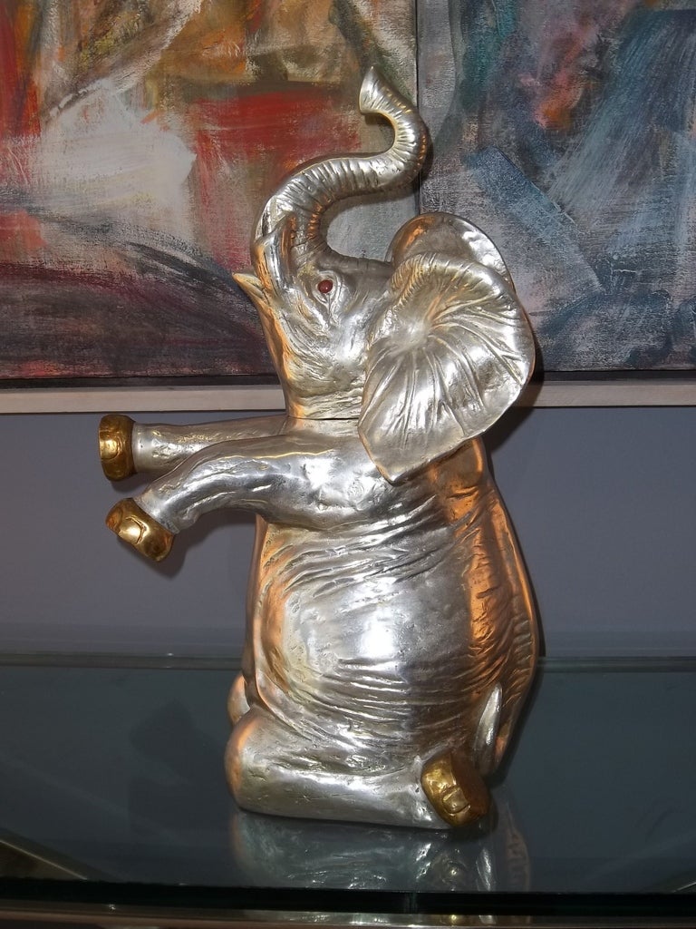 A dated and labeled ice bucket by Arthur Court.
The elephant form of this ice bucket is whimsical and charming.
Beautiful details and use of mixed metal materials.
Large in Scale.