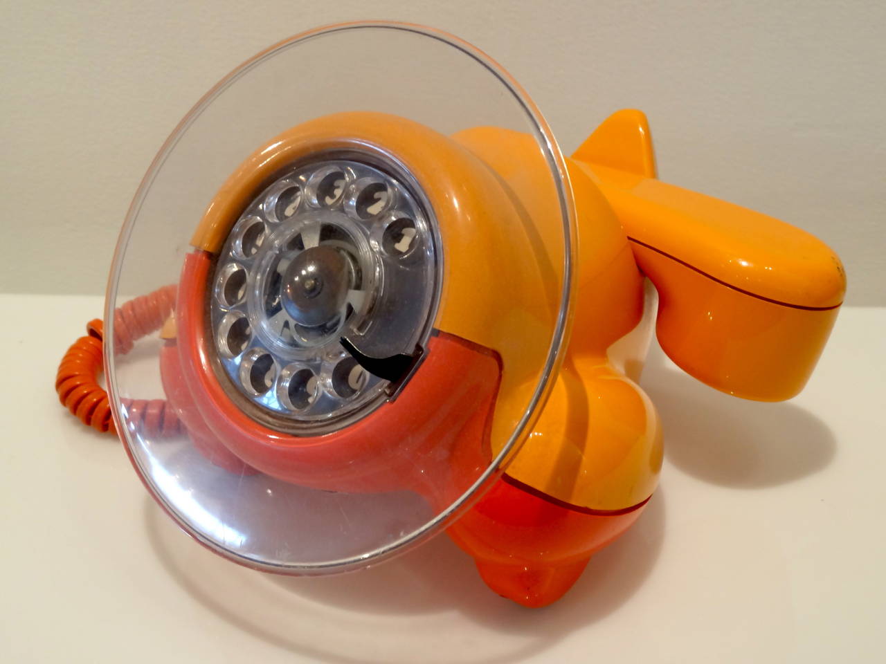 A most unusual phone of lucite in the form of an airplane.
the bright color combination compliments the whimsical nature of this piece.
A great piece of pop art .