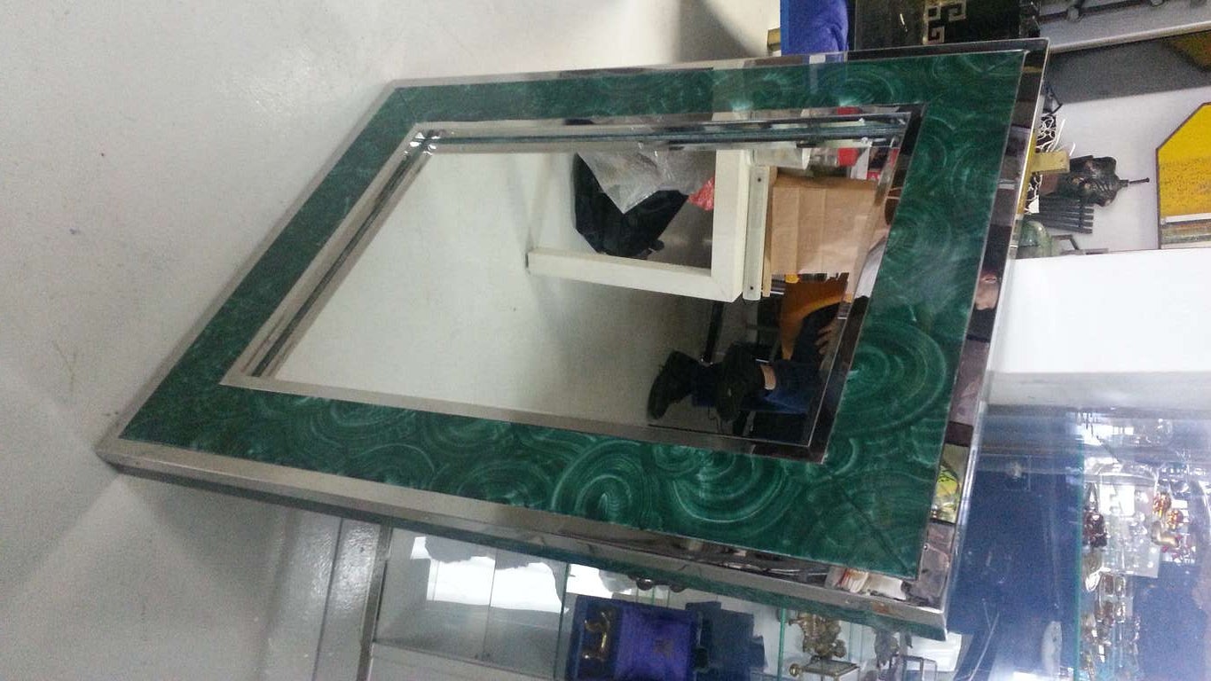 A beautifully finished mirror of faux malachite and inset in nickle plated fittings.
This mirror is very much in the style of karl Springer.
Clean lines and scaled nicely.