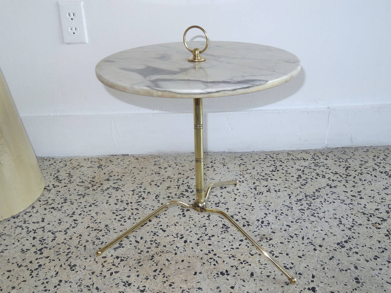 Beautiful Mid-Century brass side table with marble top. The design of the tripod leg is most interesting with a spider like form. Beautifully detailed and finished.
Gio Ponti in design and era.