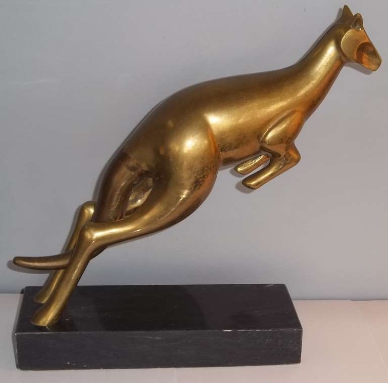 A sculpture of a brass kangaroo in motion. This piece has a modern flair and has great scale.
Mounted on a granite base