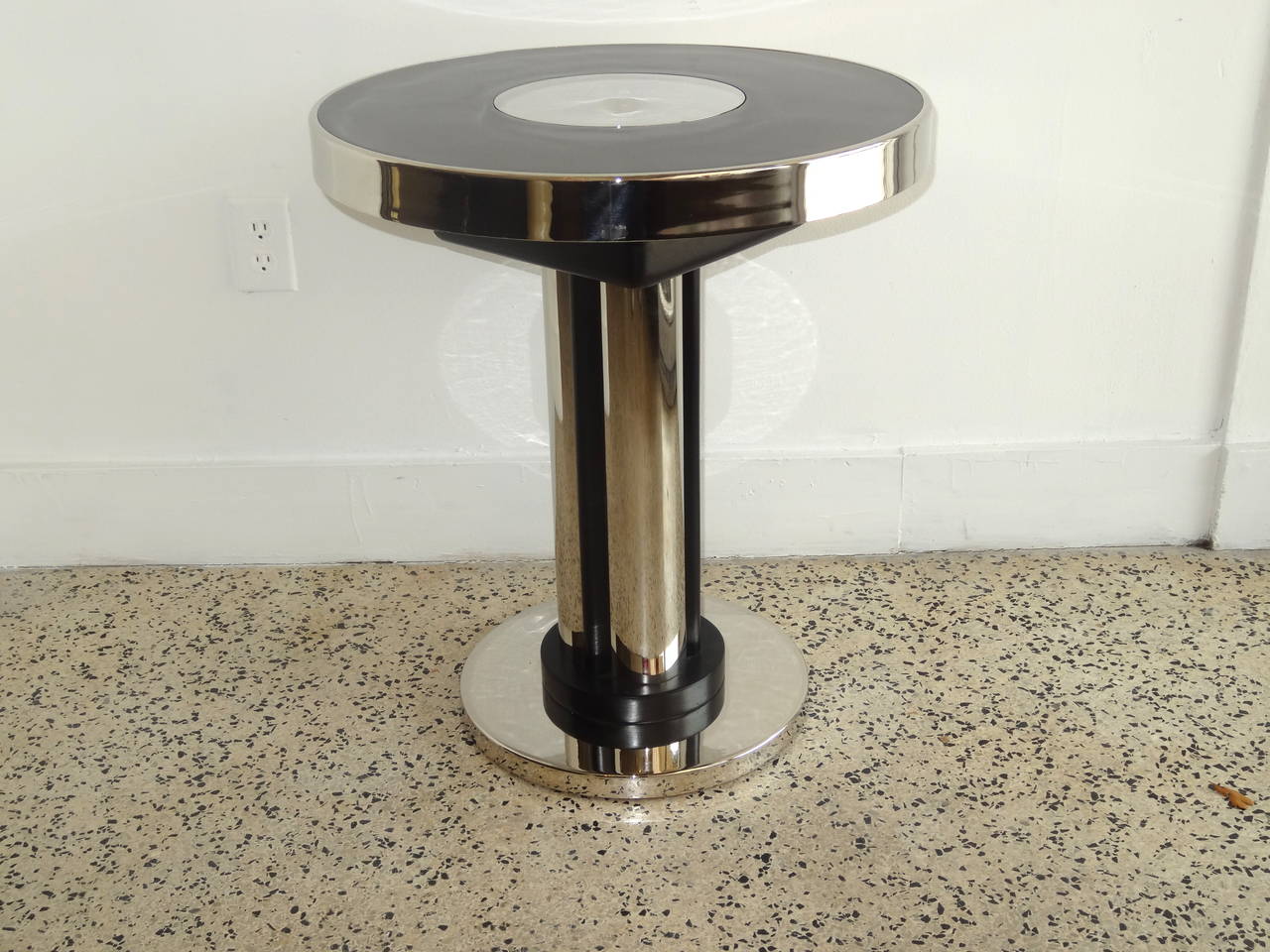Art Deco side table with nickel plated metal and espresso stained wood parts.
Has just restored.