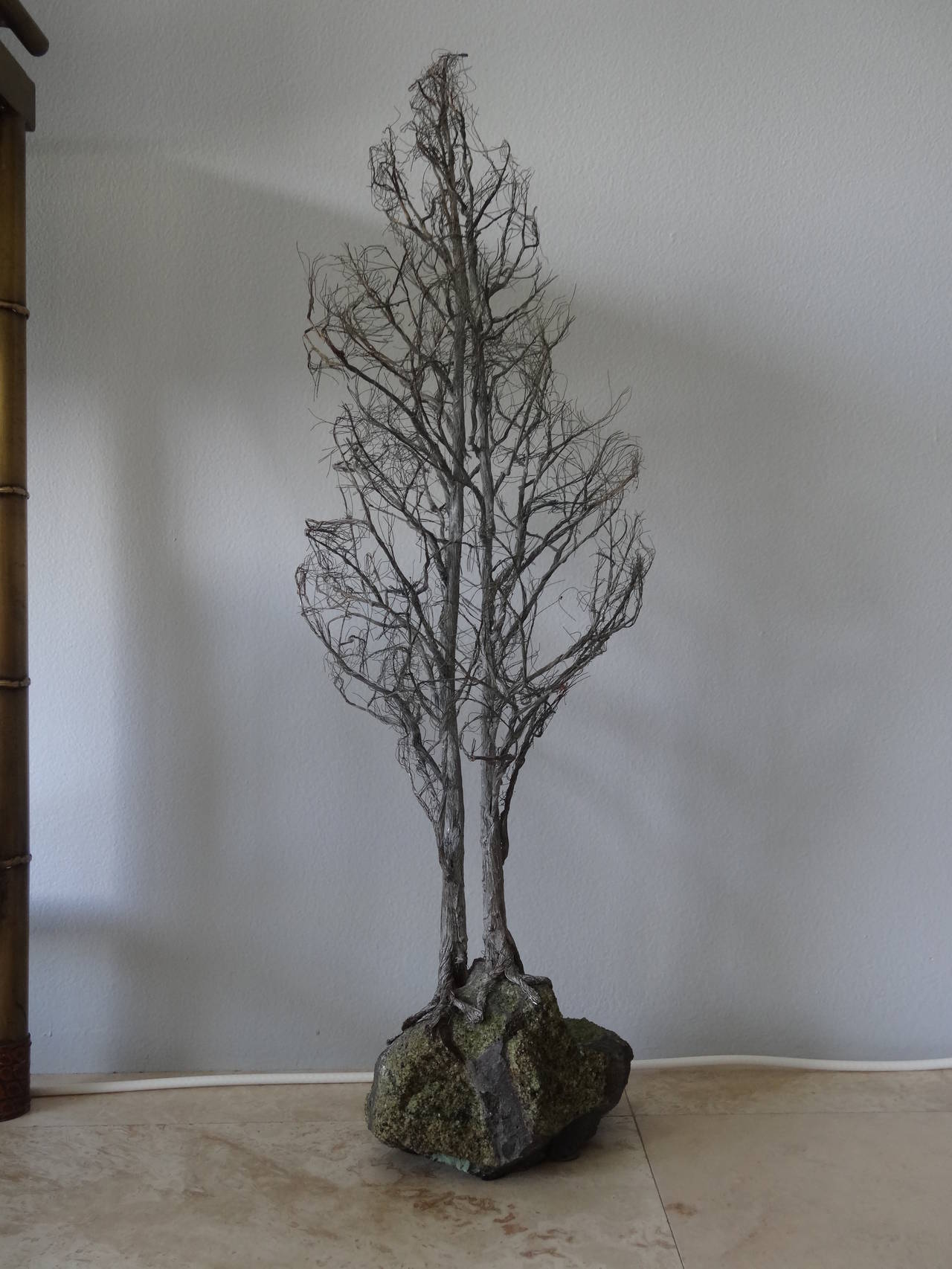 A silvered metal tree mounted on a geod.
Beautifully detailed and finished with the branches having this fine feathered looked.
Great size