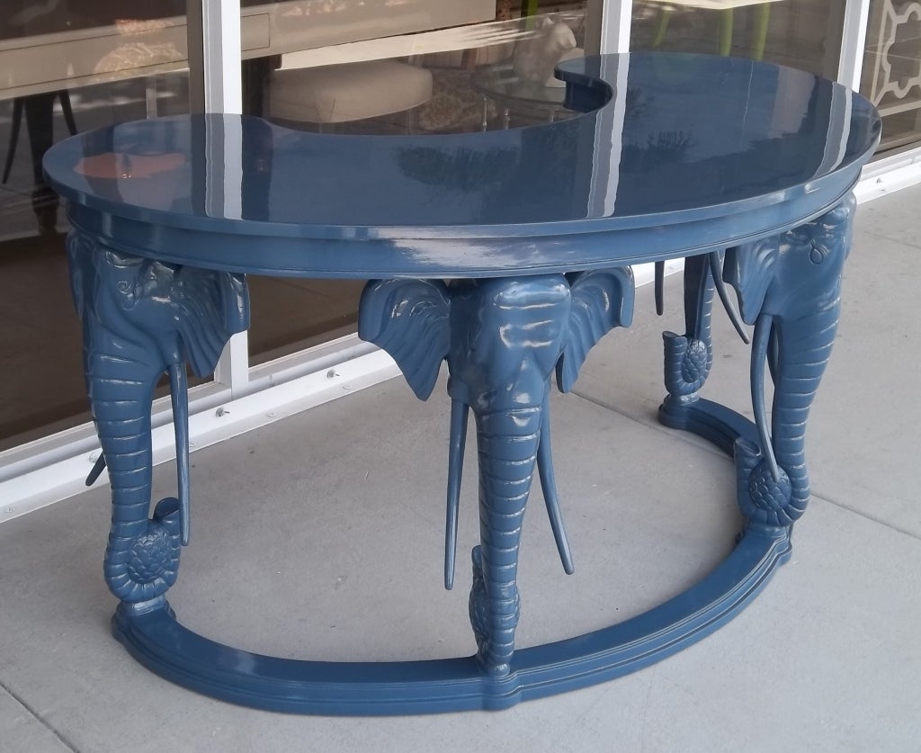 a very glamorous elephant desk. This piece is freshened up with a new modern color and high gloss finish. Very Hollywood