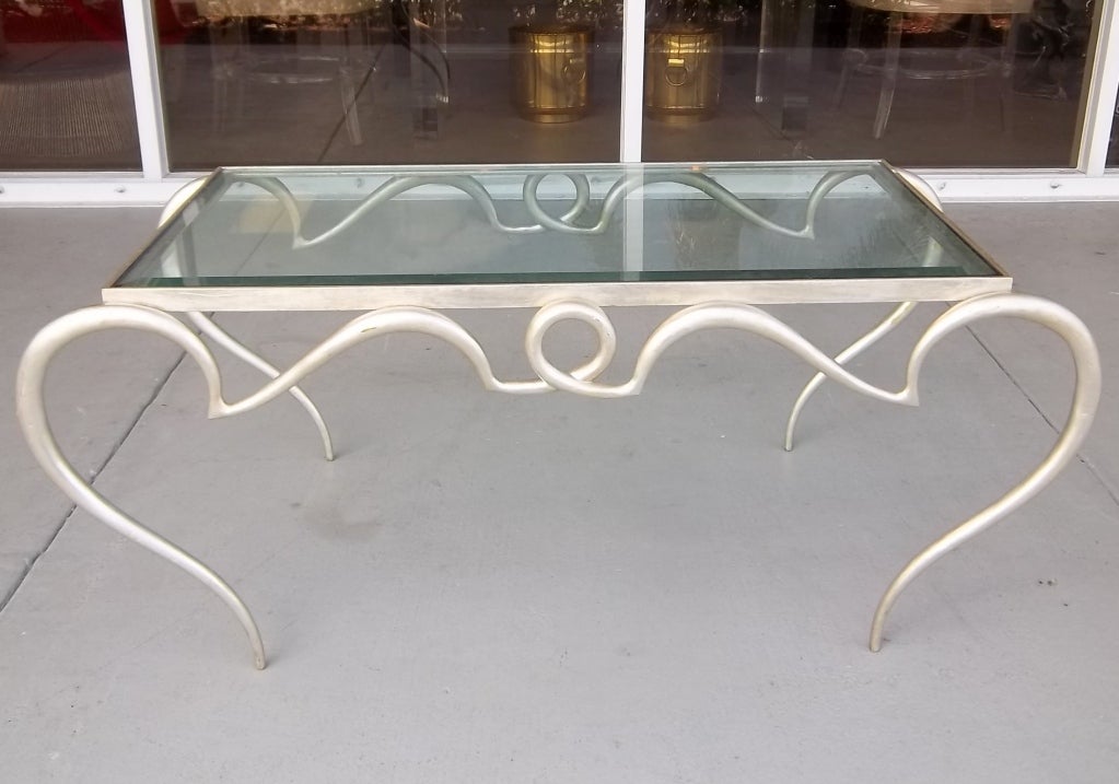 A fantastic silvergilt metal coffee table designed and formed like a french 40ties coffee table. Great design.