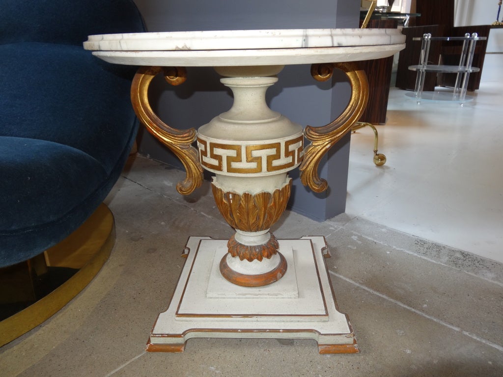 A fabulous giltwood and painted urn formed table. Neoclassically
Inspired base with the greek key desifn and handled
Urn form. Nicely weathered marble top.