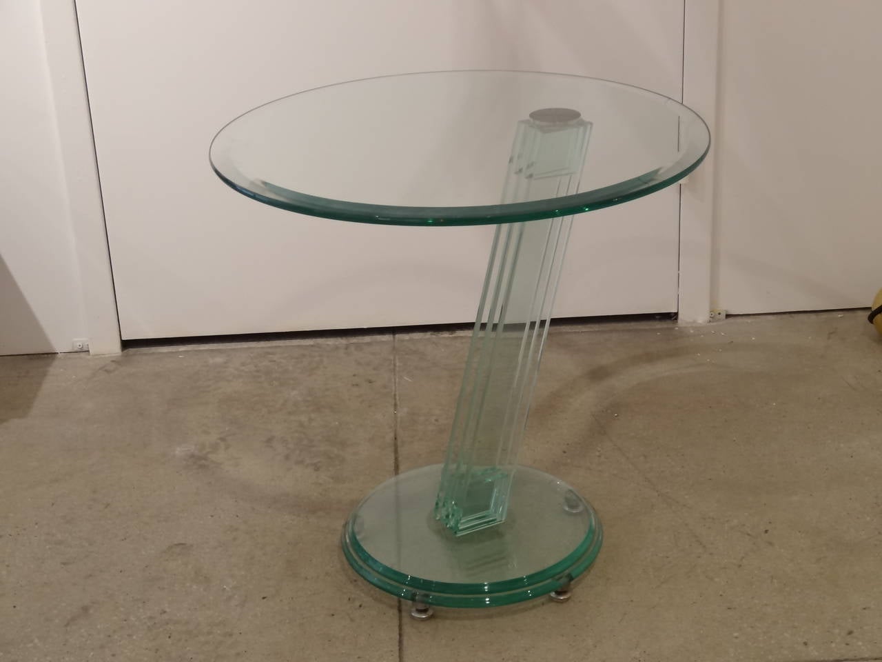 Pair of masculine glass tables in style of Fontana Arte, circa 1980s.