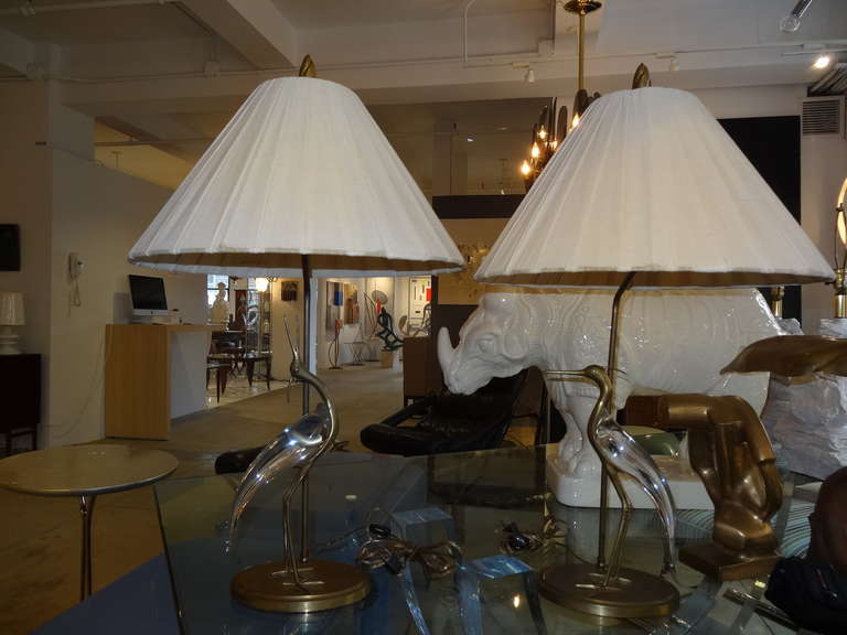 A beautiful pair of glass and brass egrets mounted as lamps. Lamps are labeled
Chapman.
Very elegant pair of lamps.
