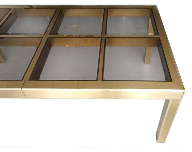 A beautiful brass table by M asterCraft.
this table is simple and elegant.
beautifully finished with a brass Parsons style frame and having an inset glass panellled top.
table has to extensions which when used make this table very impressive and