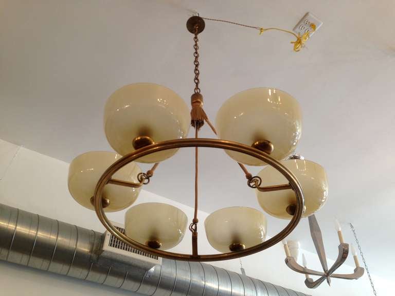 A wonderful large 1920s Austrian gold chandelier with silk cords and large hand blown glass bowl shades. Eight light sources. Rewired.