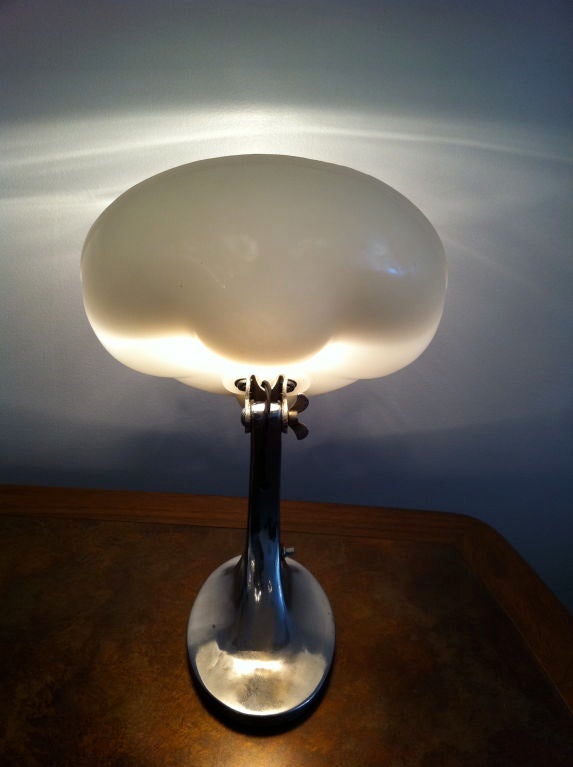 An American Deco steel and molded white glass table or wall light. Braided cord.