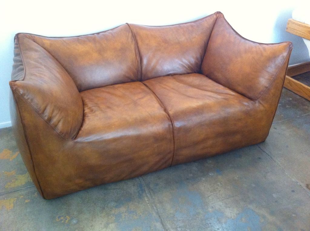 A great original aged leather sofa by Mario Bellini . Matching chair available.