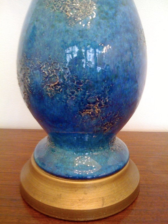 A wonderful pair American art pottery lamps with  mottled colors of blue,green,and gold.
