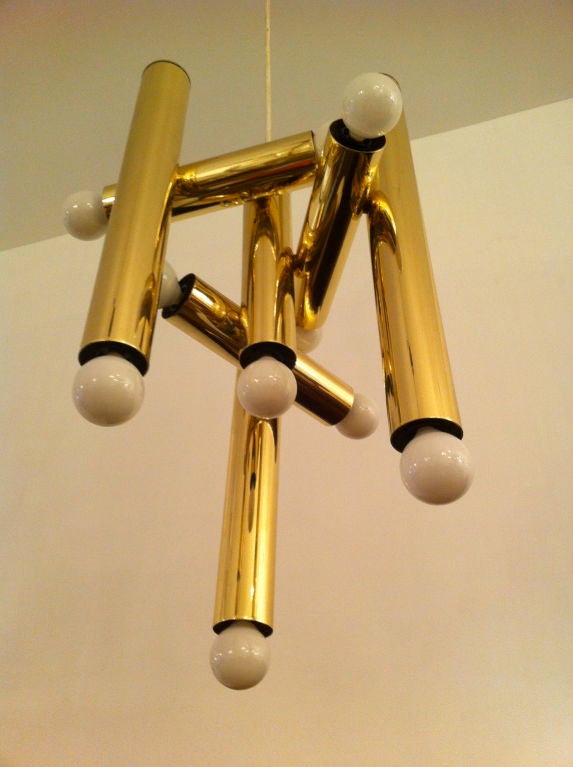 A sculptural polished brass Italian 1960's pendant light. 10 light sources