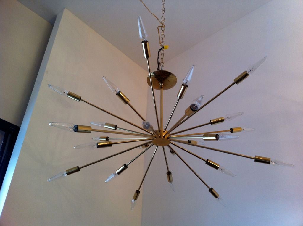 The original Sputnik designed light fixture by Gino Sarfatti. Solld brass parts. Made in a short production from 1954 - 1959.