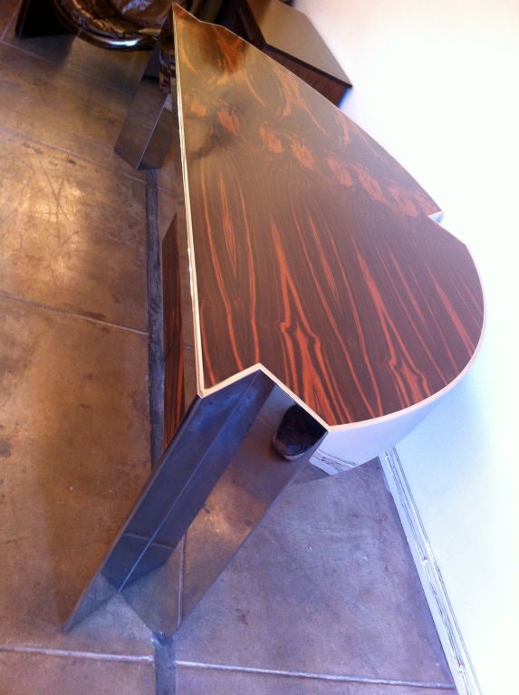 An amazing 1970s high polished chrome and ebony macassar desk by Leon Rosen for Pace Collection. A half moon shape with three triangular cut-outs . Two drawers. Satin finish.