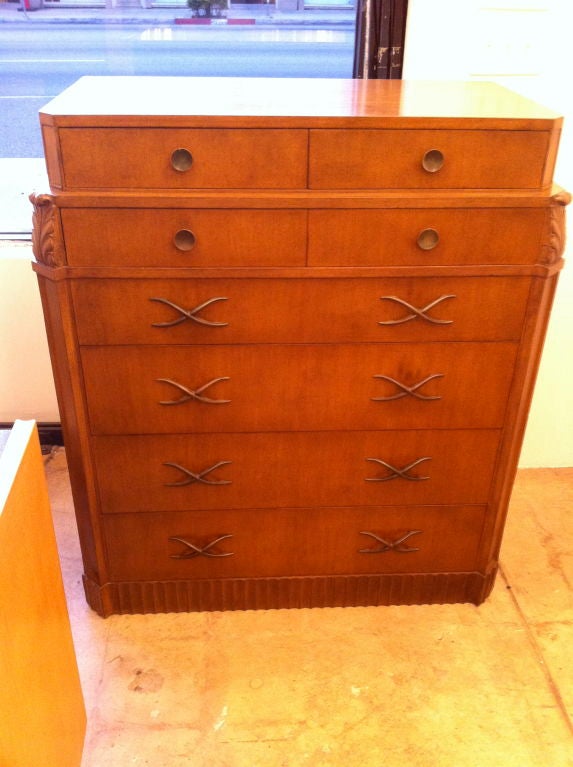 A very smart 1940's mottled brown painted finish carved walnut highboy dresser or chest of drawers.Antique decorative brass pulls. Eight drawers. Matching low boy available.