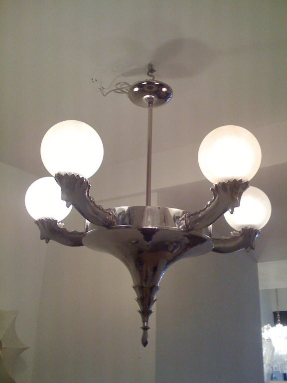 A beautiful all original Austrian Secessionist chandelier with frosted spun sugar glass globe shades.