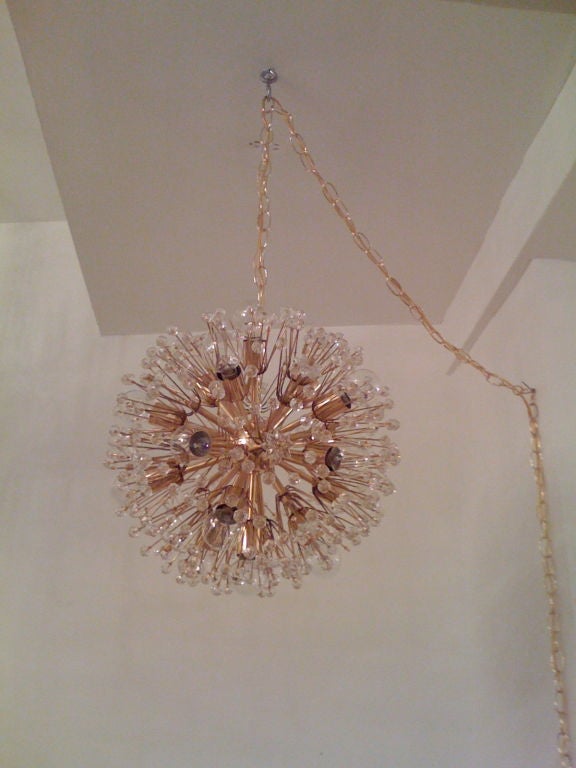 An Austrian crystal and brass 1960's sparkling chandelier.  12 light sources.