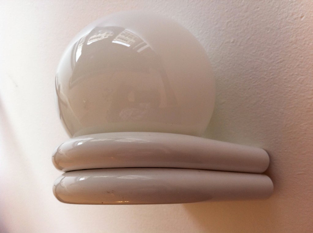 A pair of French 1980's white enameled sconces with milk glass globe shades. 5.5" deep