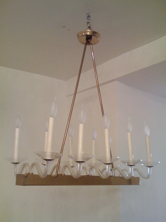 A great simple and modern Italian chandelier with Murano glass arms and bobeches. Ten-light sources.