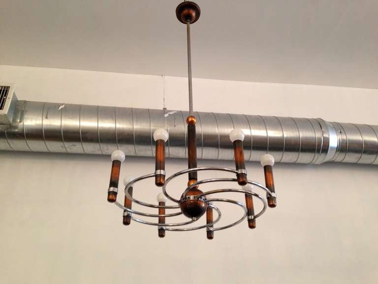 A wonderful 1940s Italian copper and chrome modernist eight-light chandelier. The chandelier's body without the pole is 16