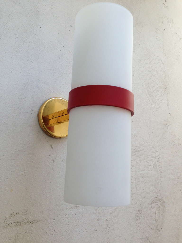 A great 1950s Italian red enamel and polished brass sconces with milk glass tube shades. Rewired.