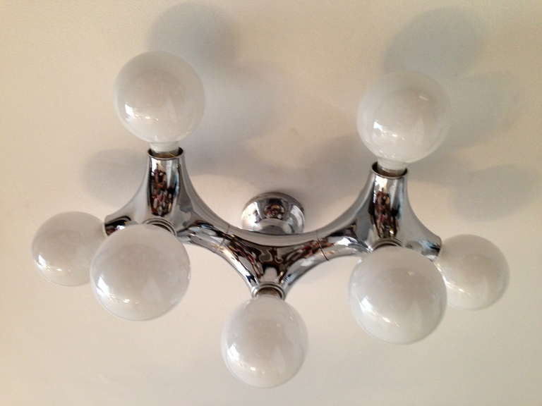 A 1960s German chrome PVC Space-Age molecule ceiling or wall light by by the German lighting company, Cosack. Eight light sources. Rewired. . Came out of an Antwerp cinema.