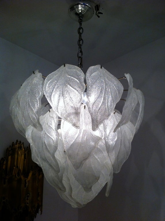 A great leaf glass tiered Murano Chandelier with a chrome frame. When lit the glass looks like spun sugar.