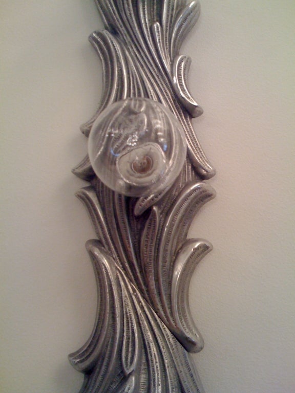 A large silver six light wall/ceiling light.