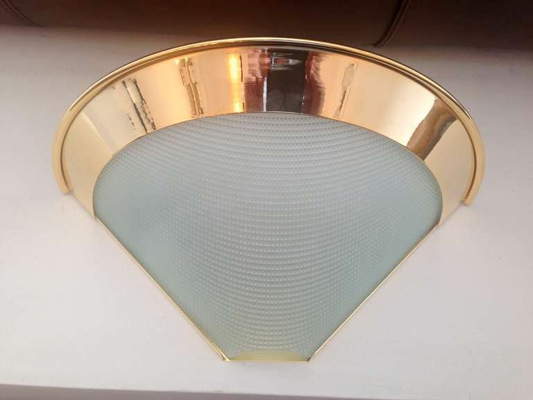 1980s Italian gold-plated wall lights with very light green waffle glass shades. Never been used. Original labels. Sold in pairs.