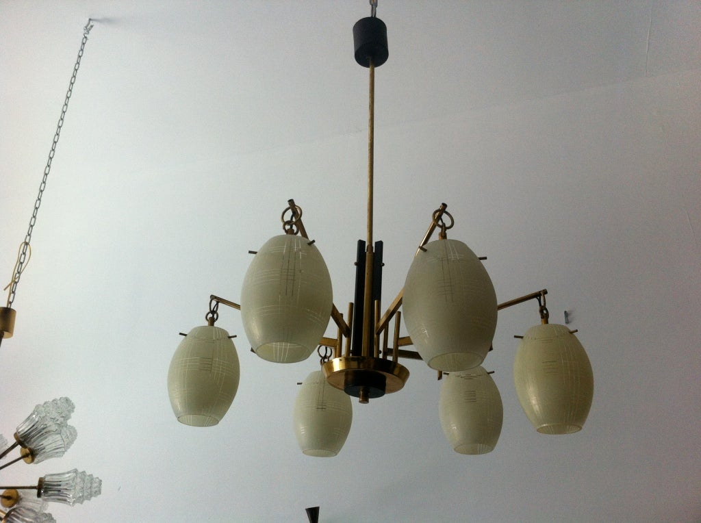 A nice six glass light chandelier with brass and black enamel accents.