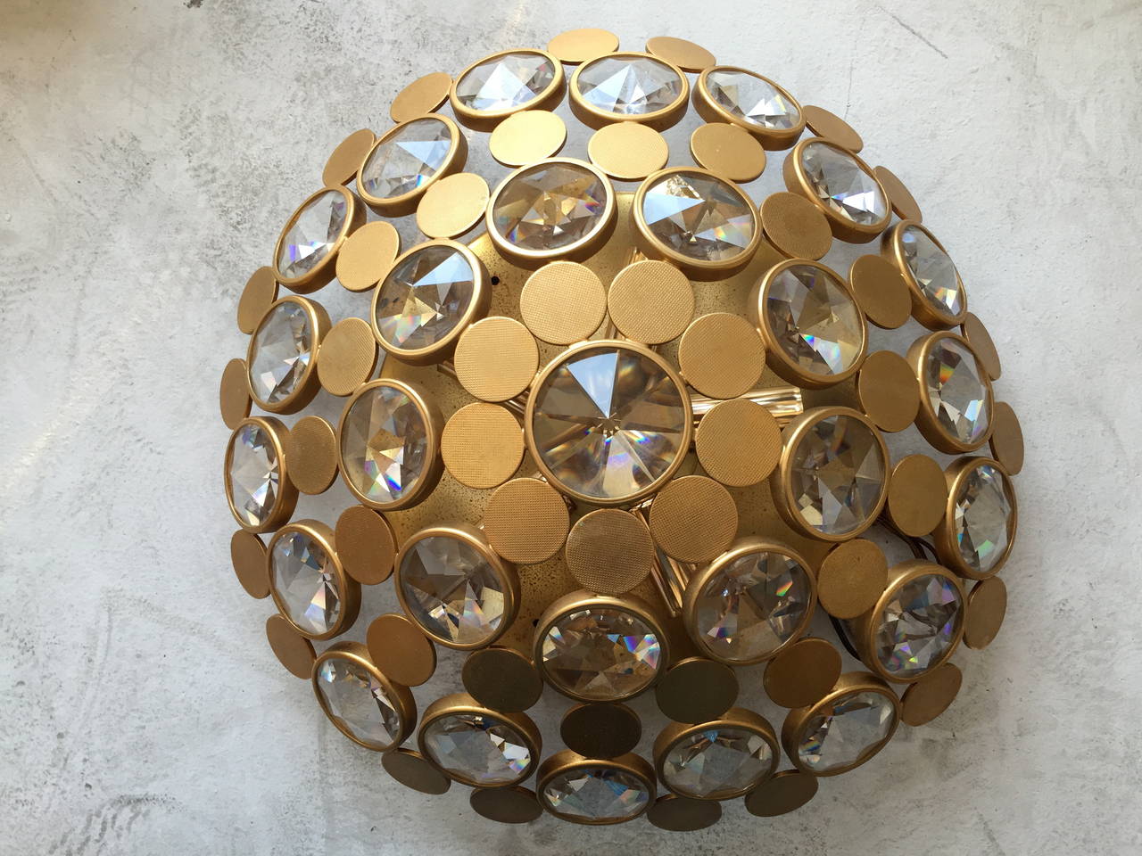 A great 1970s Italian flush ceiling light composed of a matte gilded finish and thick Austrian crystal shade. Rewired.