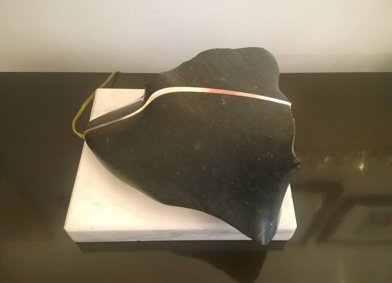 A wonderful 1980s light sculptural by American artist, Christoph Spath. It is composed of a marble base and part polished and rough black stone. Rewired. Signed.