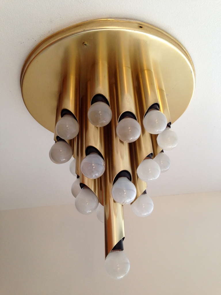 A great 1960s Dutch modernist satin brass twenty-four-light flush ceiling light by the lighting firm, RAAK. Rewired.