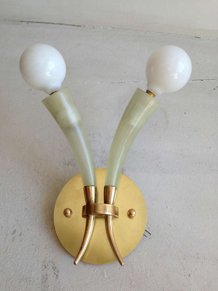 A 1940s pair of light celedon green Murano blown glass wall lights with a brass fixture by Barovier. Rewired.