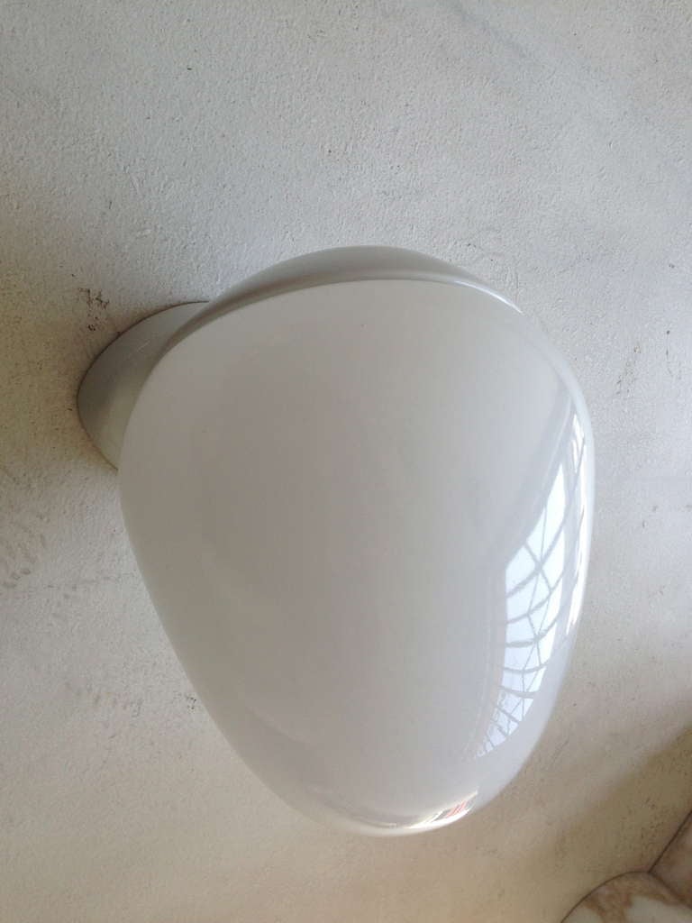 A Great pair of 1920s Bauhaus design white porcelain sconces with large ovoid shaped glass shades. Rewired.