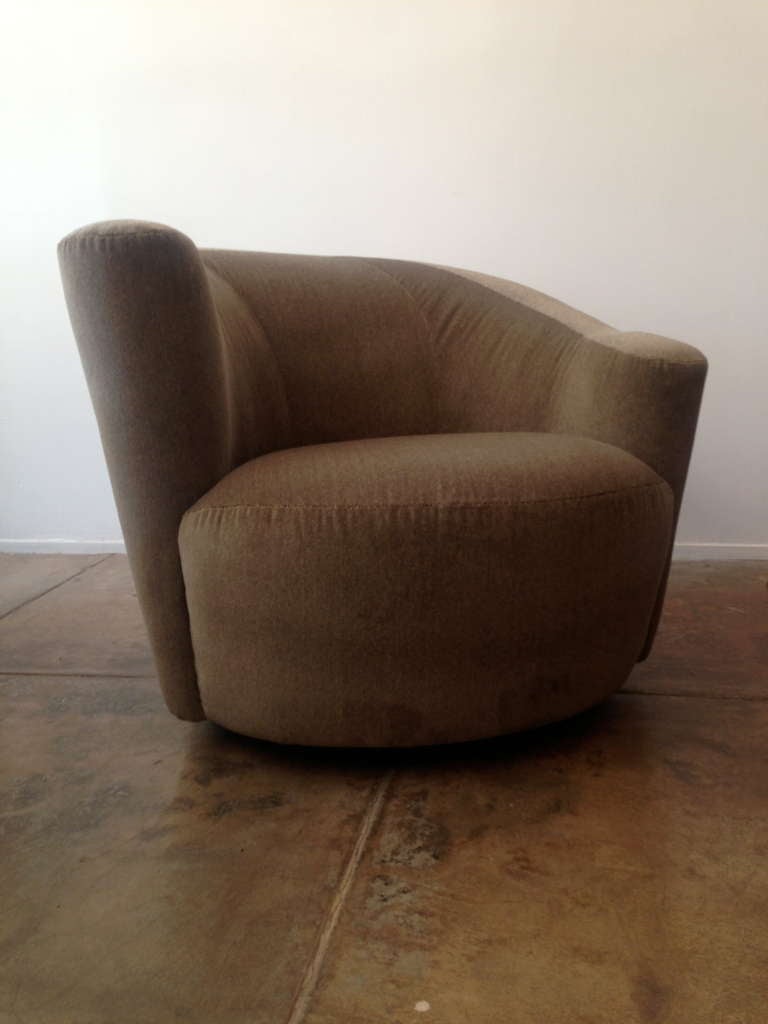 A nice pair of barrel back swivel chairs designed by Vladimir Kagan for Weiman. Reupholstered in an antique  light brown/grey short chevron striped velvet. The swivel bases have an automatic return. Original label.