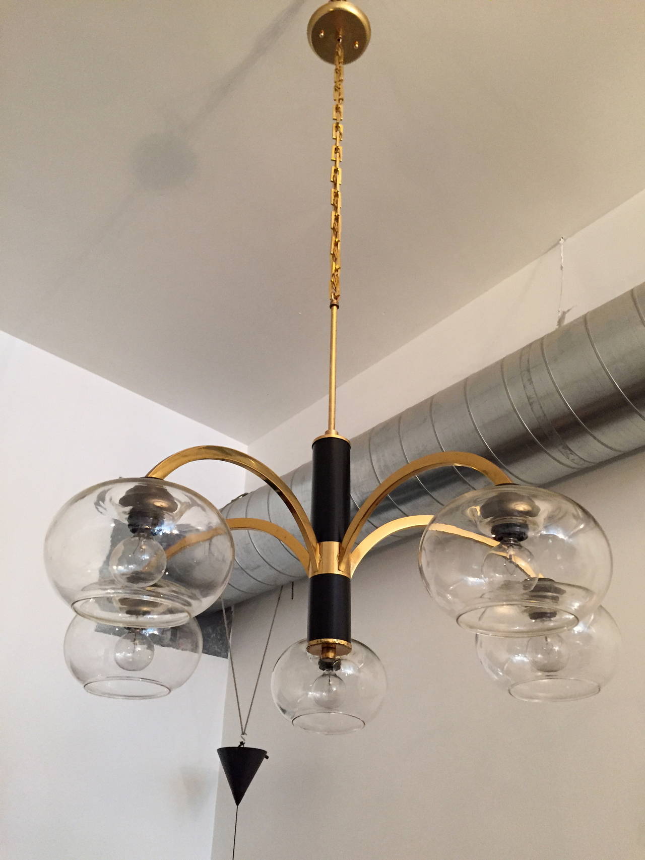 A wonderful 1960s Italian mid-century polished brass and black enamel fixture with light straw glass shades. Rewired.