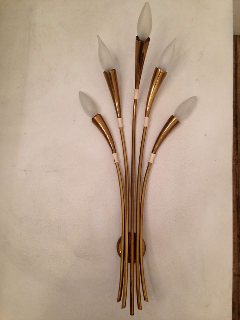 A rare pair of large Sixties Italian aged brass and white enamel sconces by the lighting firm, Lumi. Rewired.